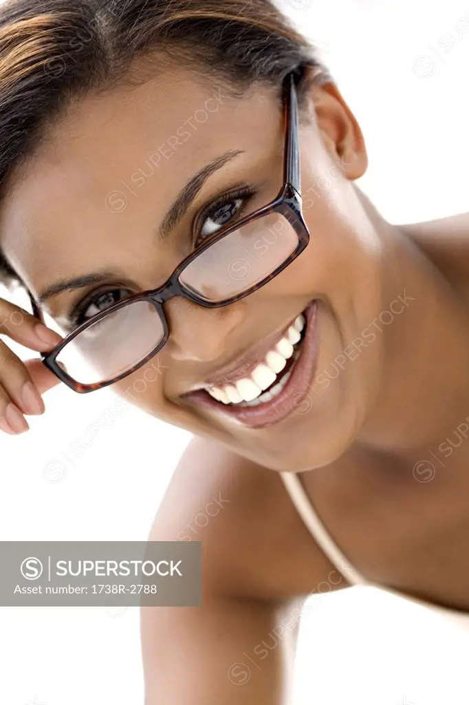 Portrait of a young smiling woman with eyeglasses