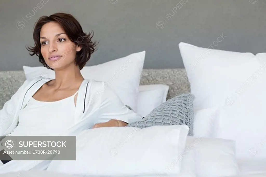 Woman reclining on the bed