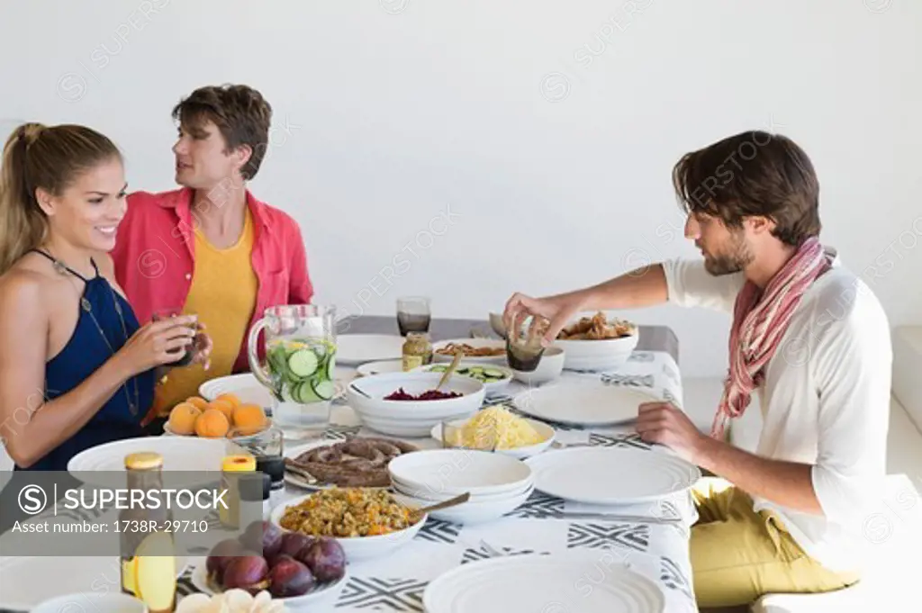 Friends eating lunch at dining table