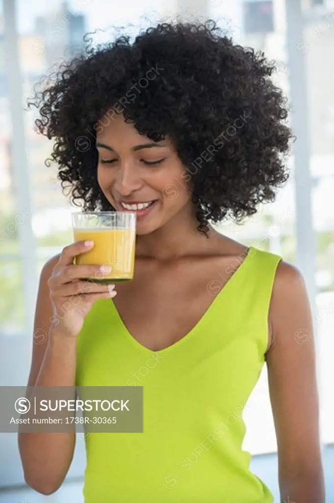 Close-up of a woman drinking mango shake