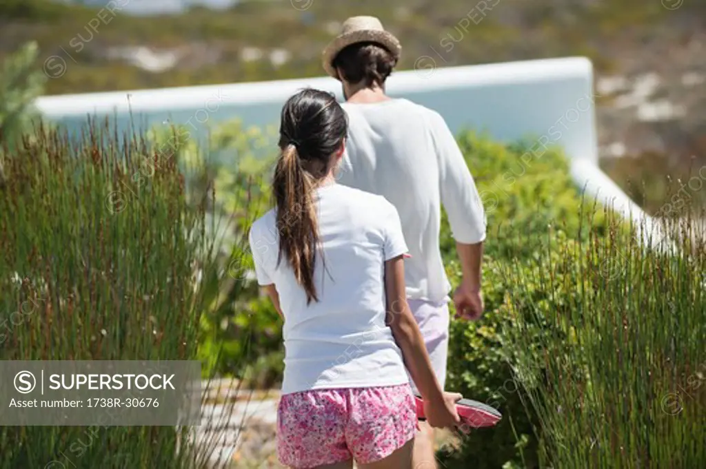 Couple walking in a garden