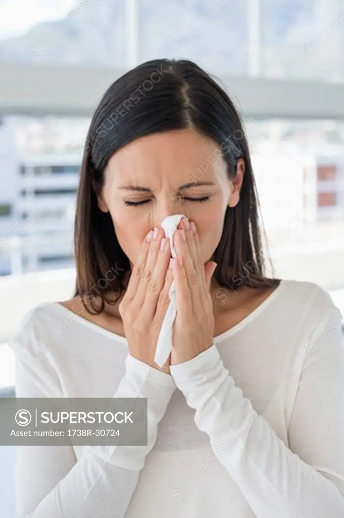 Close-up of a woman sneezing