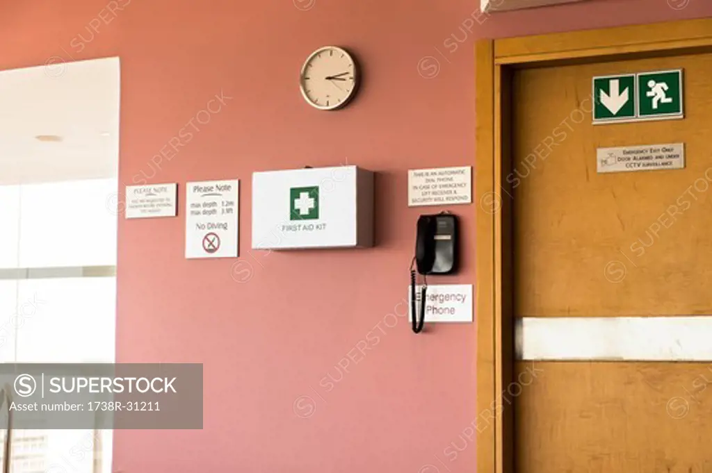Emergency exit door with first aid kit and emergency phone