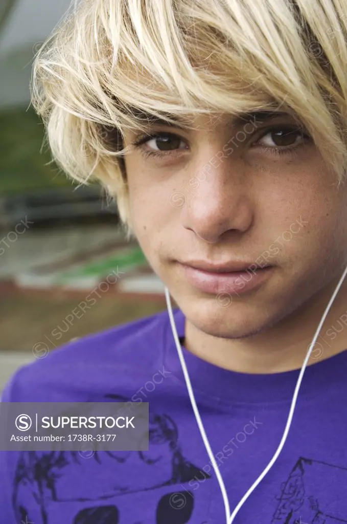 Portrait of a teenage boy with earphones