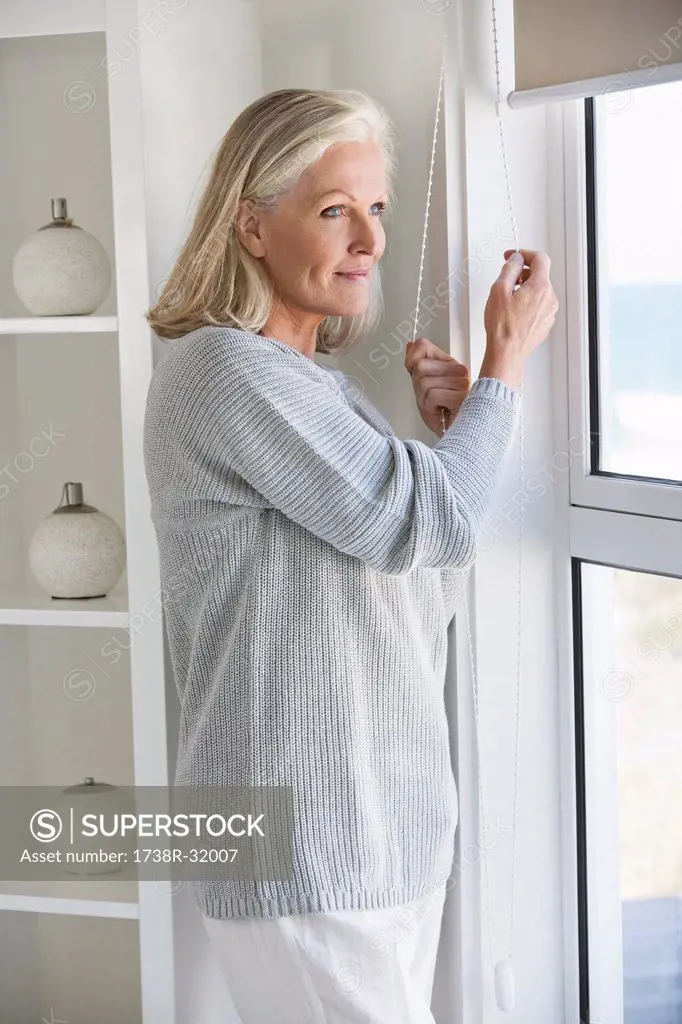 Woman looking through a window