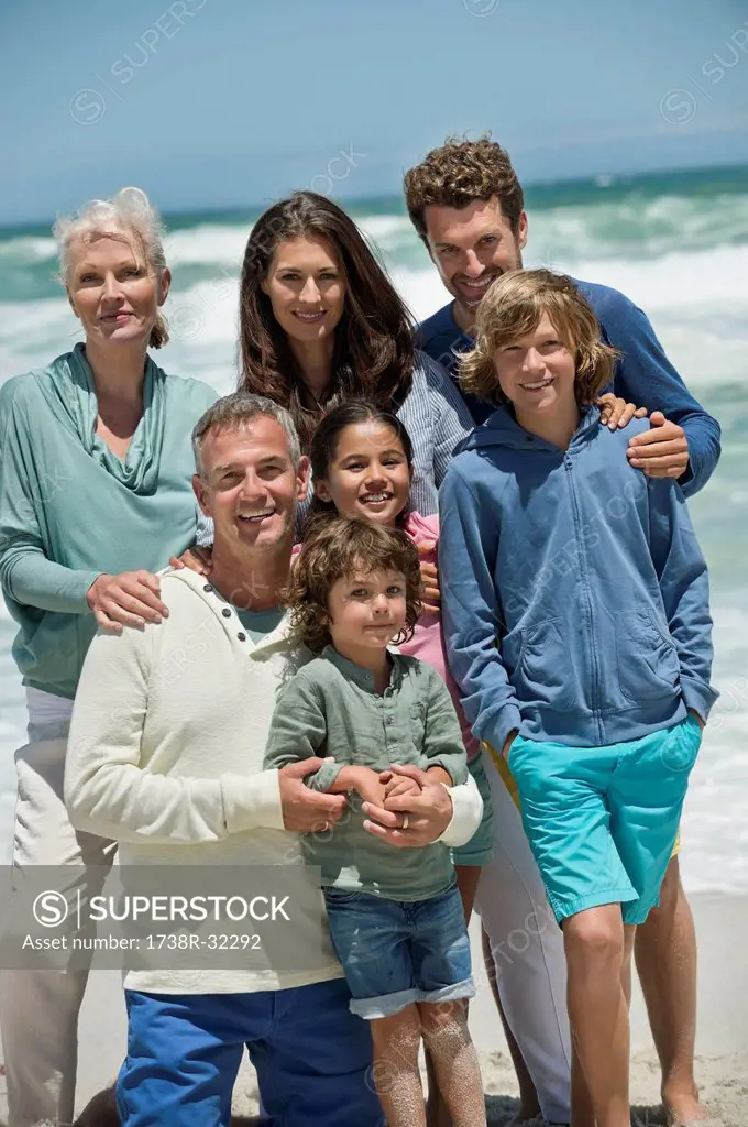 Portrait of a family smiling on the beach