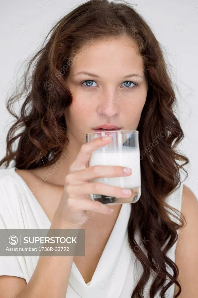 Portrait of a woman drinking milk