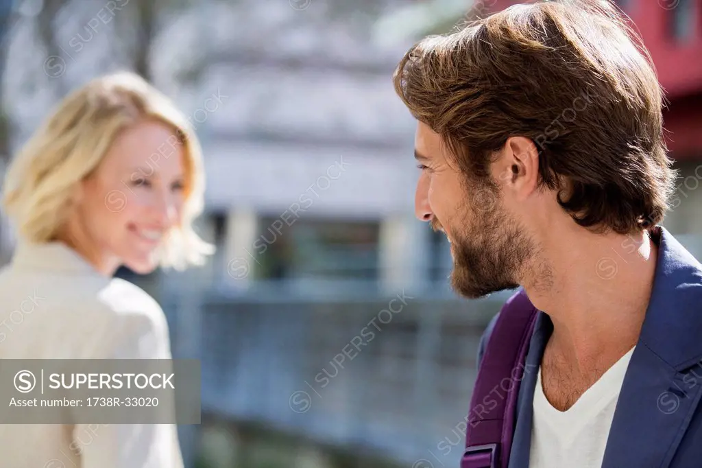 Man and woman smiling at each other