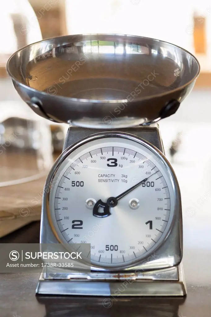 Close-up of a weighing scale at a kitchen counter
