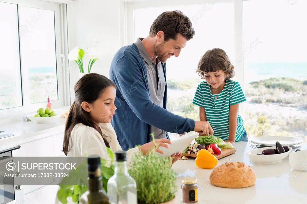 Man preparing food for his children