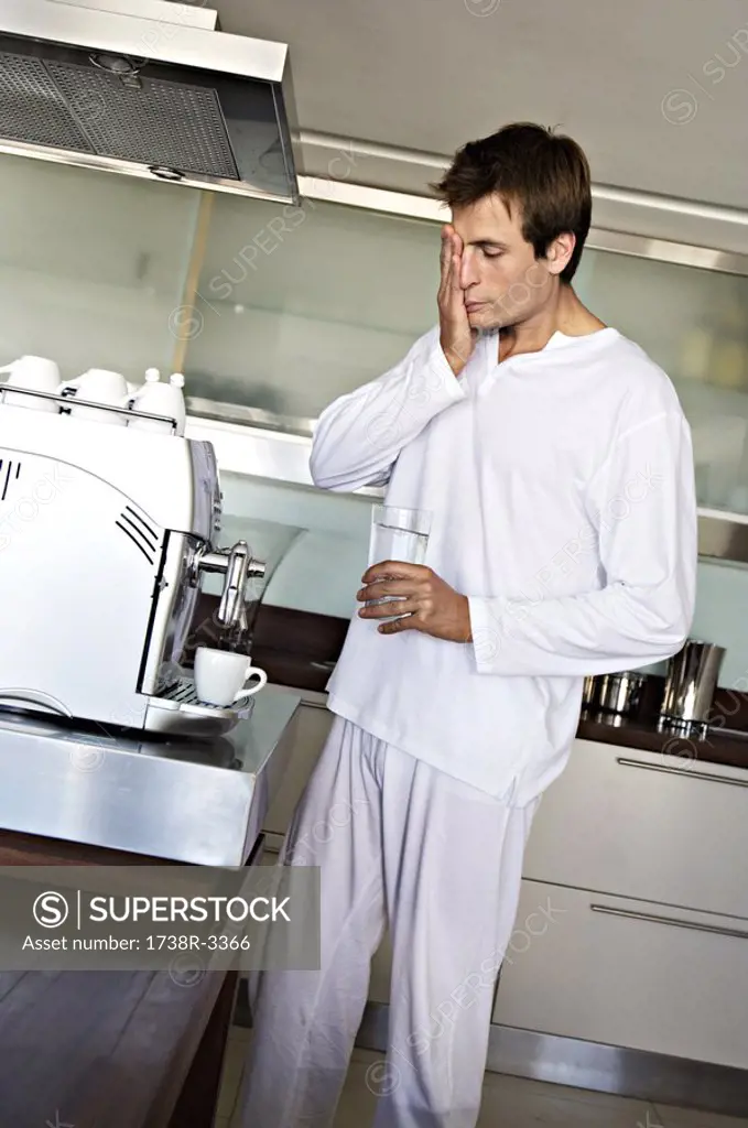 Man in kitchen preparing coffee, indoors