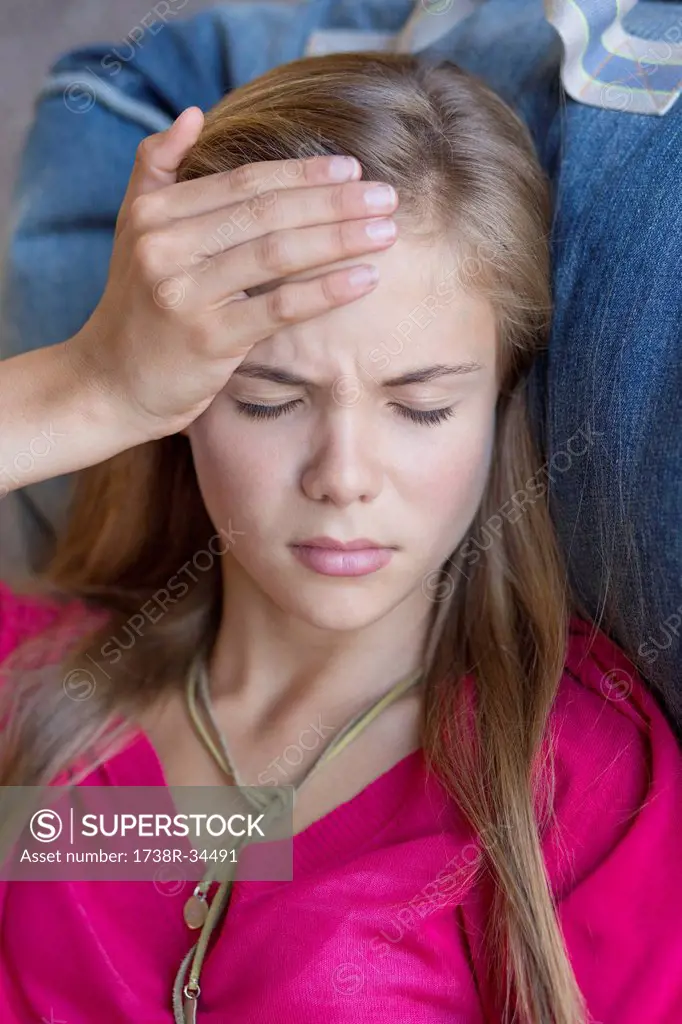 Close-up of a girl suffering from a headache