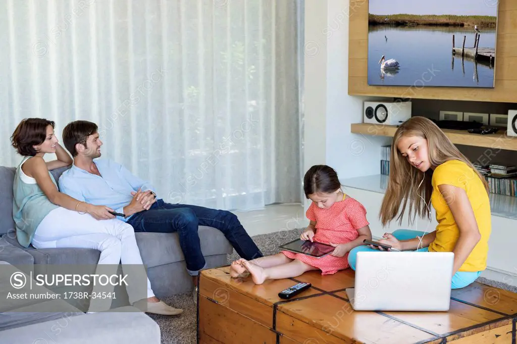 Family using electronics gadgets