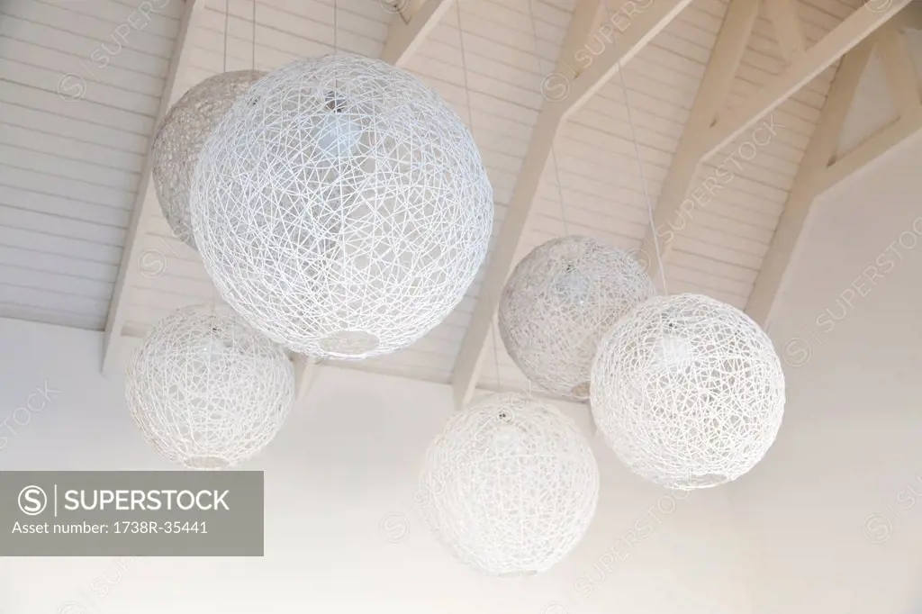Low angle view of nest shaped lamps hanging from ceiling, South Africa