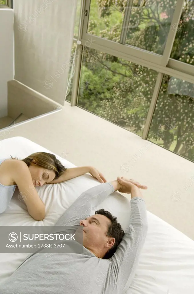 Couple in bed, indoors