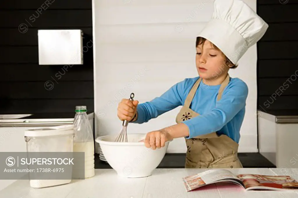 Boy making a cake