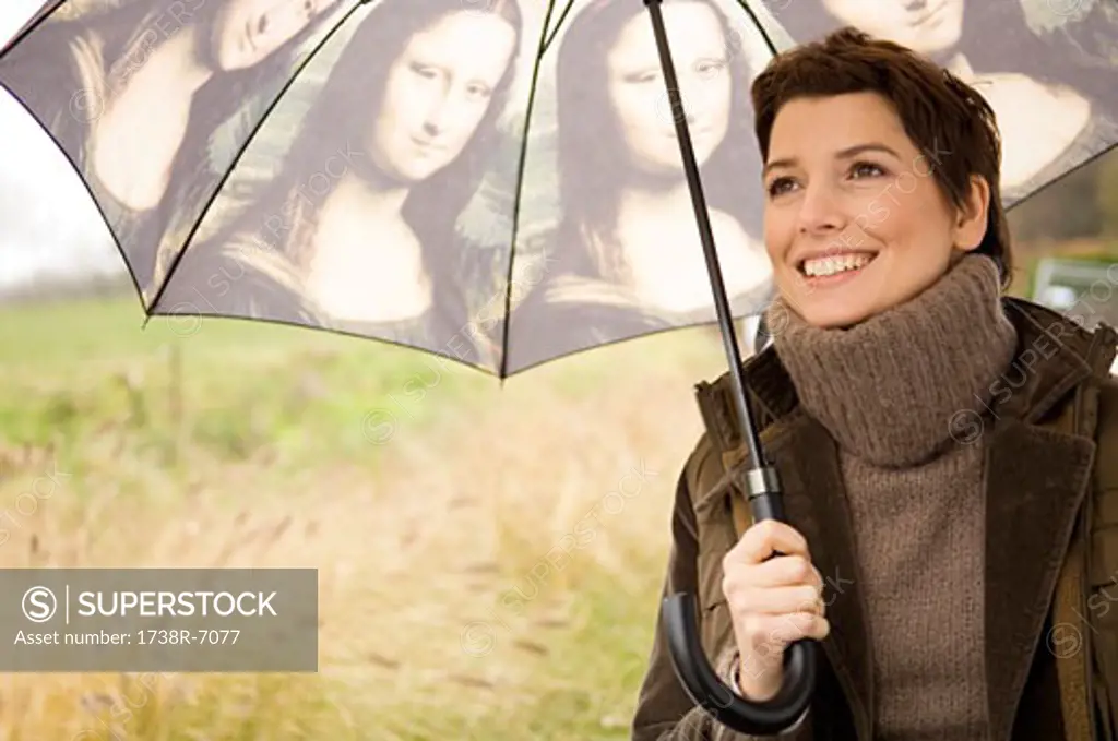 Close-up of a mid adult woman holding an umbrella