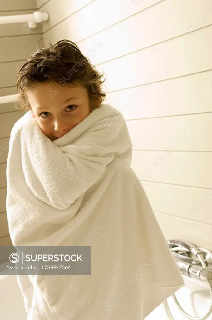 Portrait of a boy wrapped in a towel