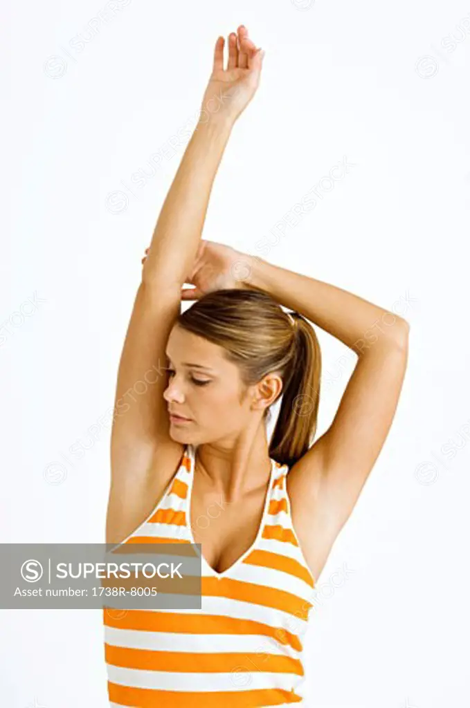 Close-up of a young woman stretching