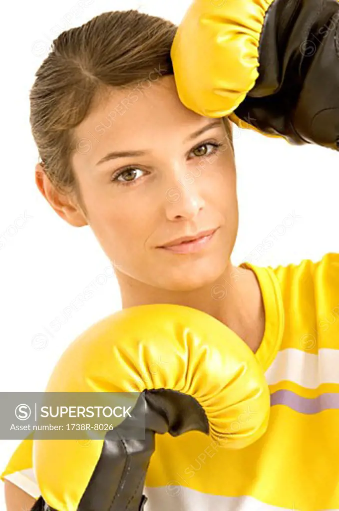 Portrait of a female boxer wearing boxing gloves