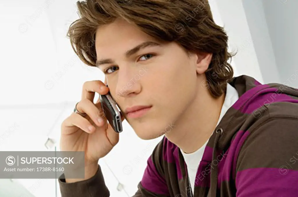 Portrait of a teenage boy talking on a mobile phone