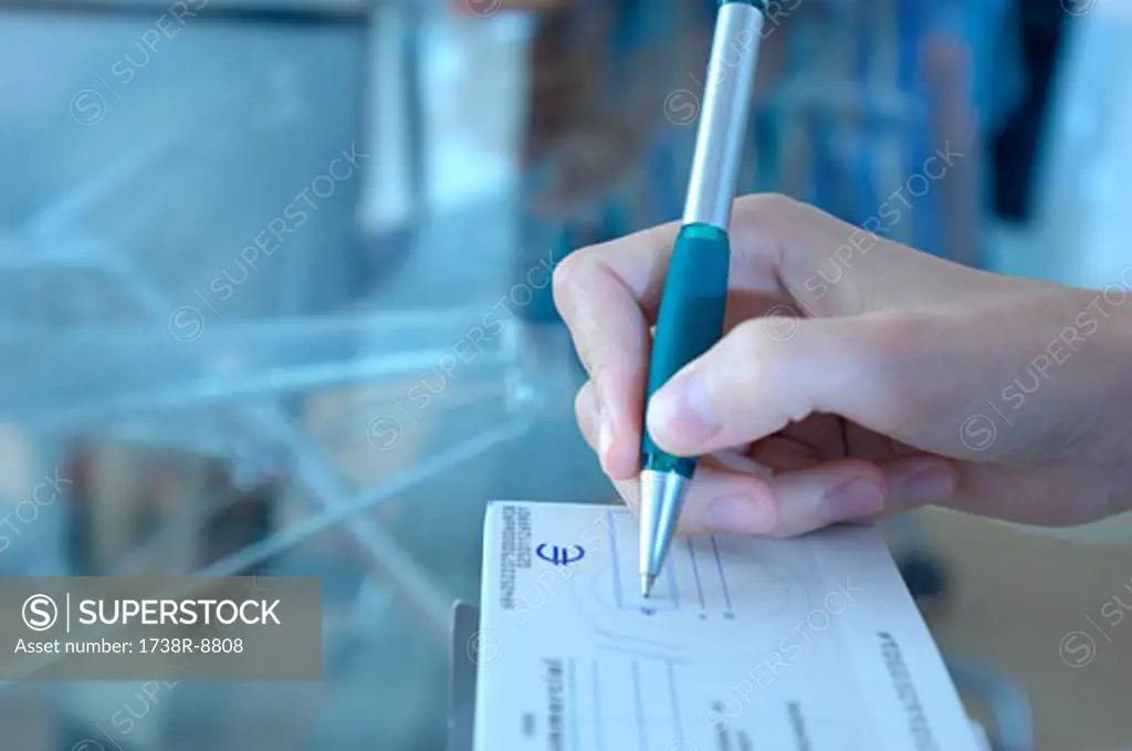 Woman making out check, close-up