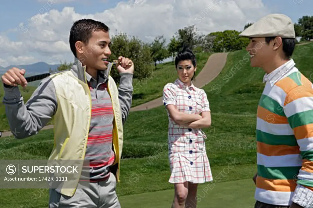 View of two men having discussion during a golf game.