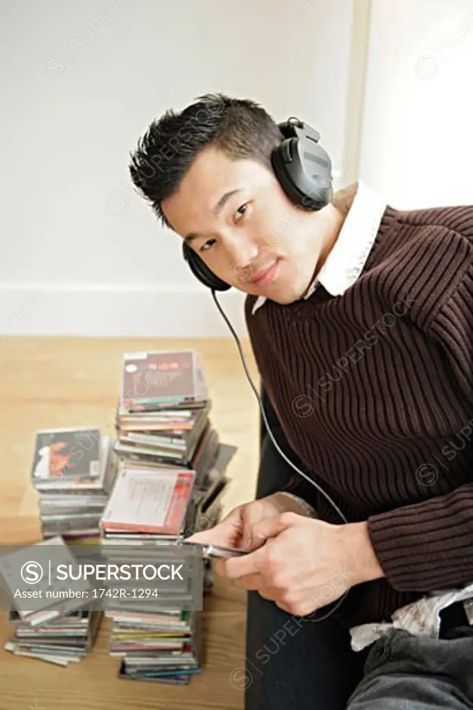 One young man listening music, portrait
