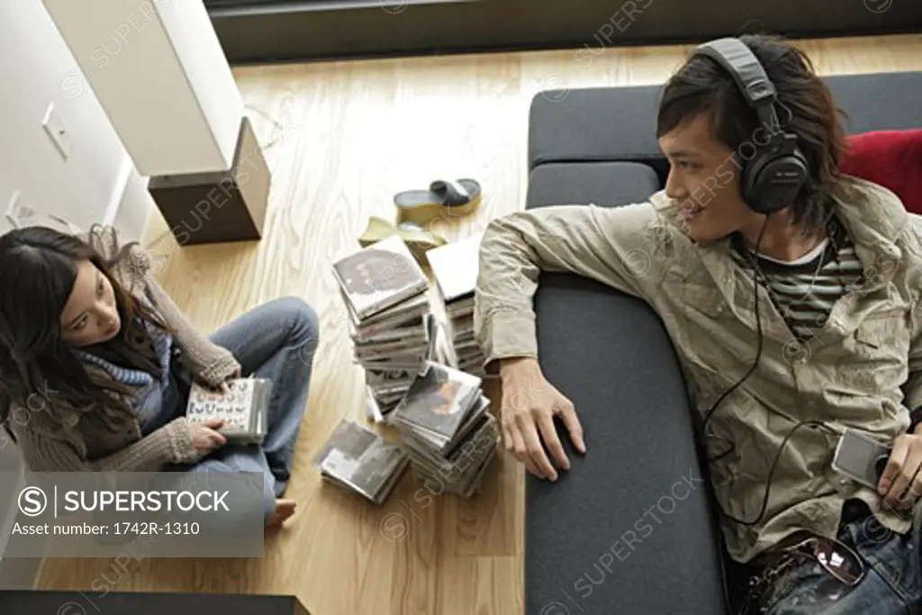 Two people sitting inside room, high angle view