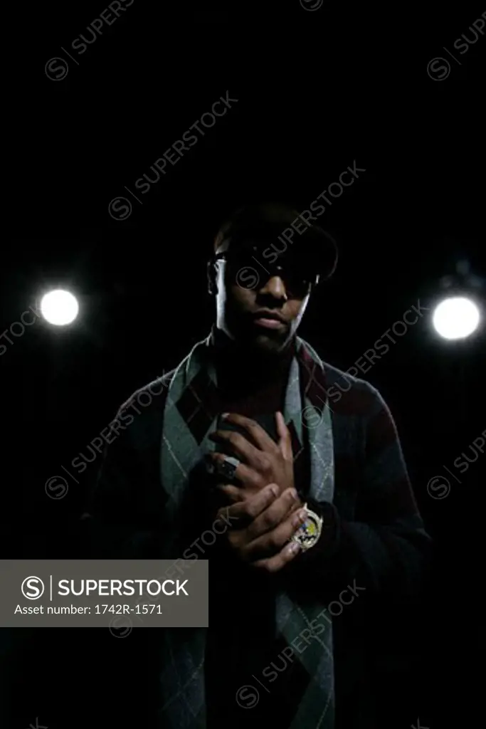 African-American man standing in front of studio lights