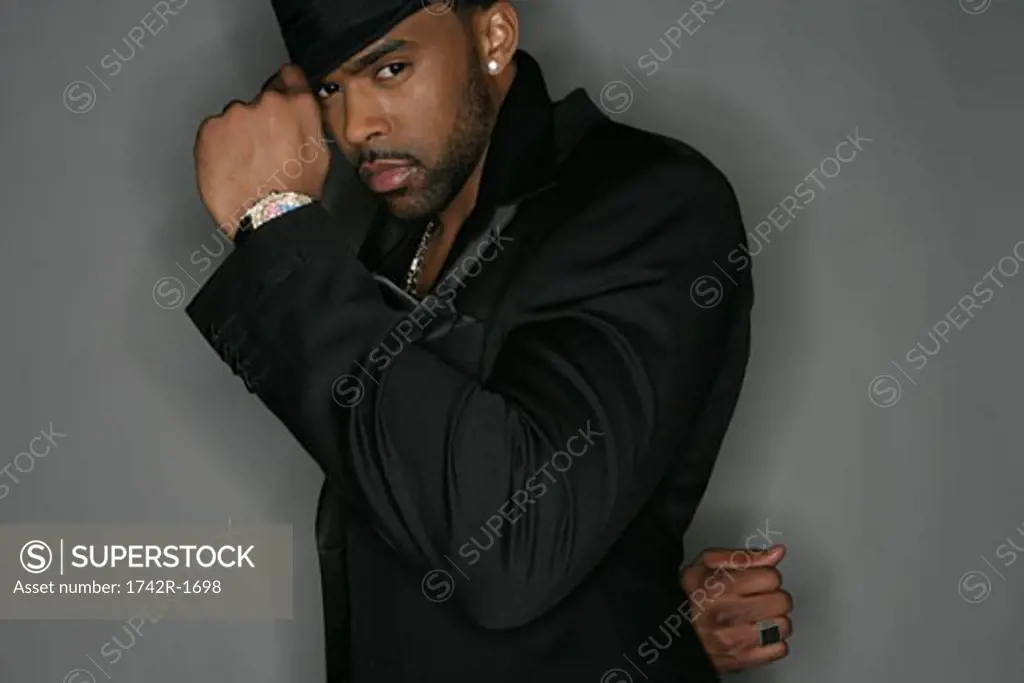 African-American man tipping his hat
