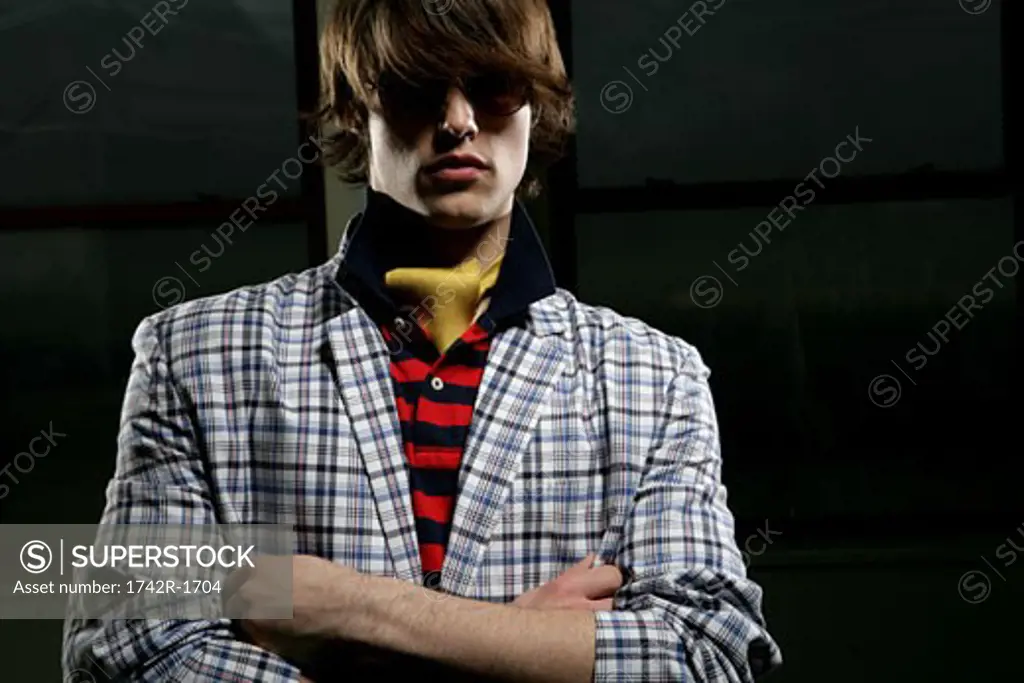 Young man wearing a plaid jacket