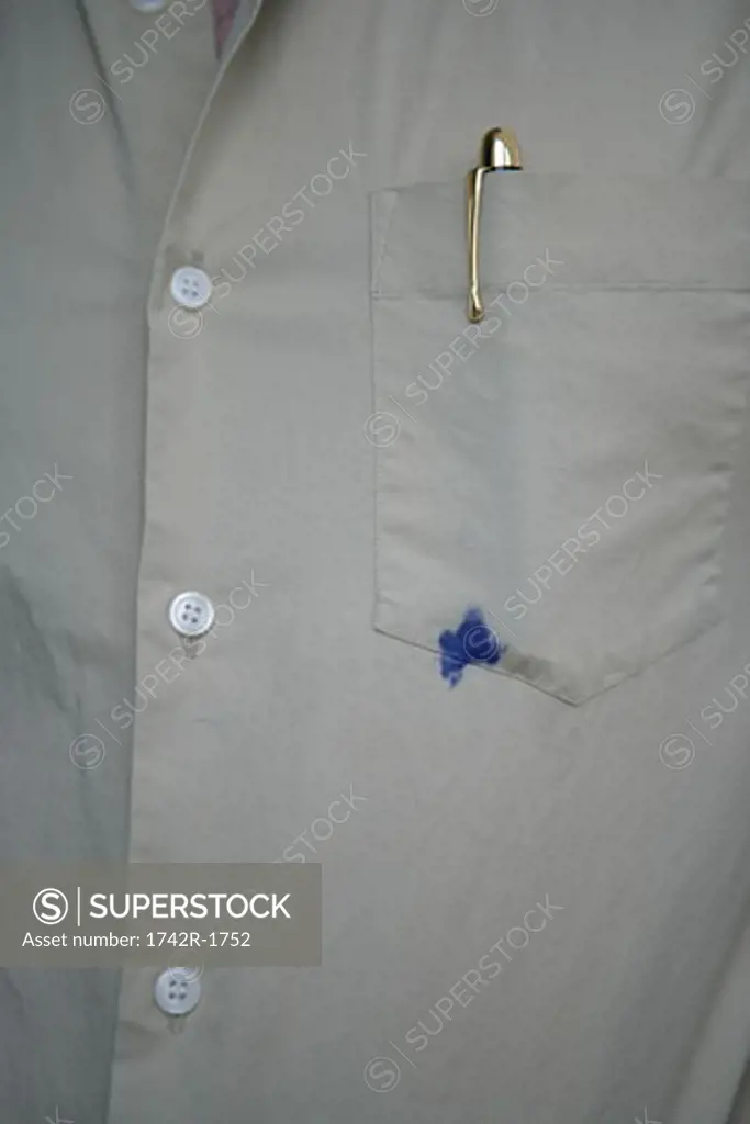 Man with ink stained pocket, midsection