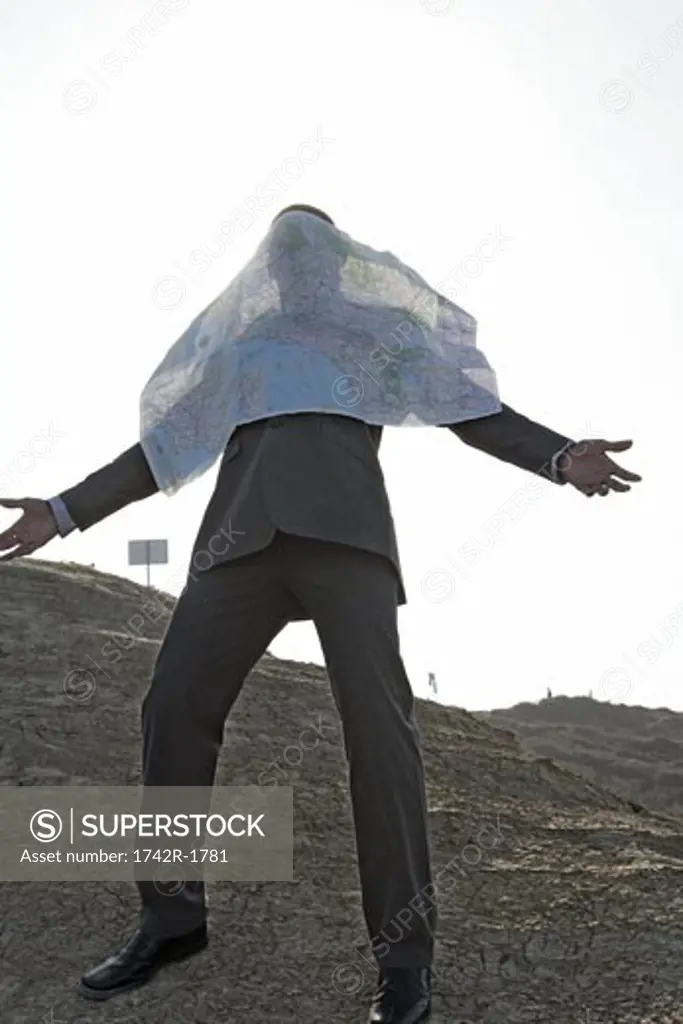 View of a man with paper covering his face.