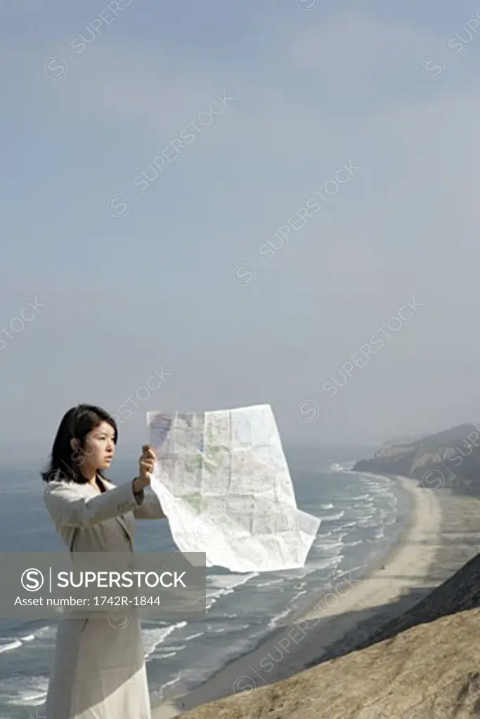 View of a woman reading a map.