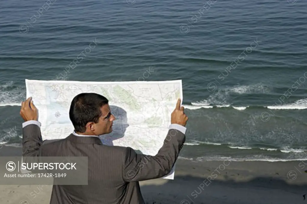 View of a man reading a map.