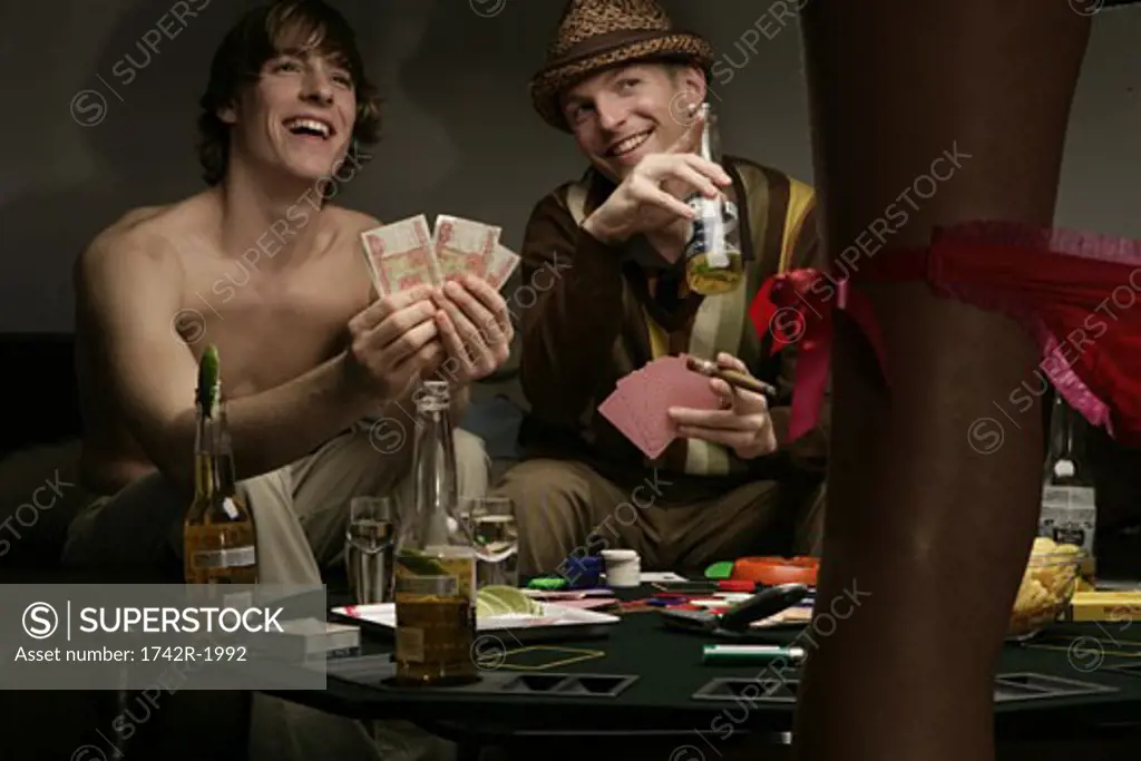View of two men enjoying a striptease.