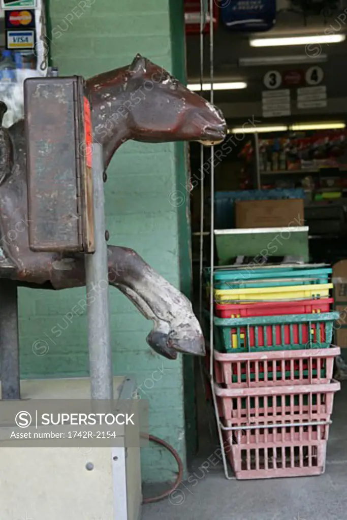 View of a horse sculpture outside a shop.