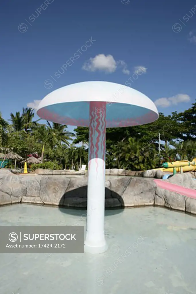 View of a canopy in the center of a pool.
