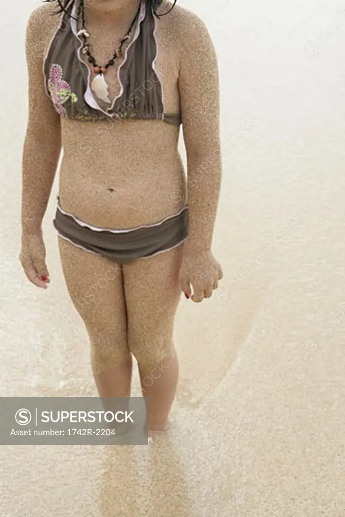 Midsection of a girl in bikini.