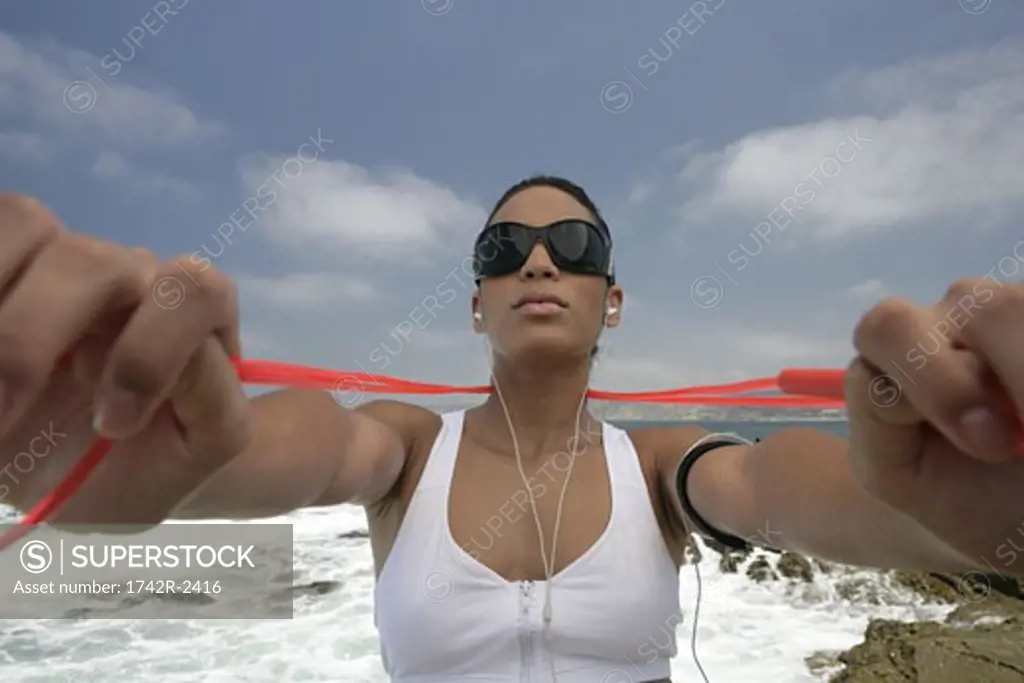 View of a woman holding a rope.