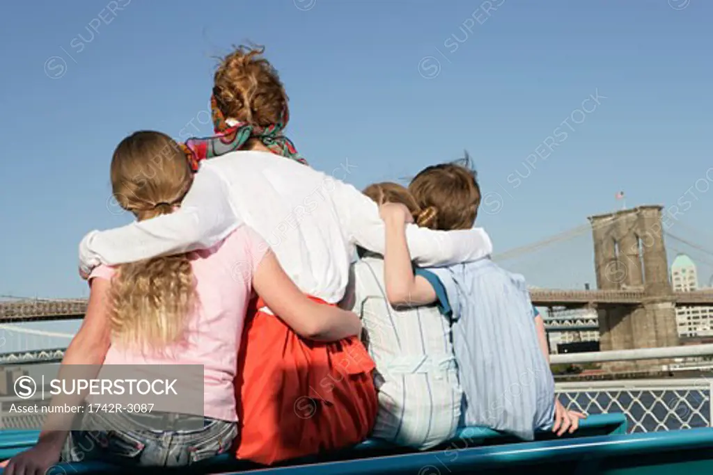 Back view of a family sitting on a ferry