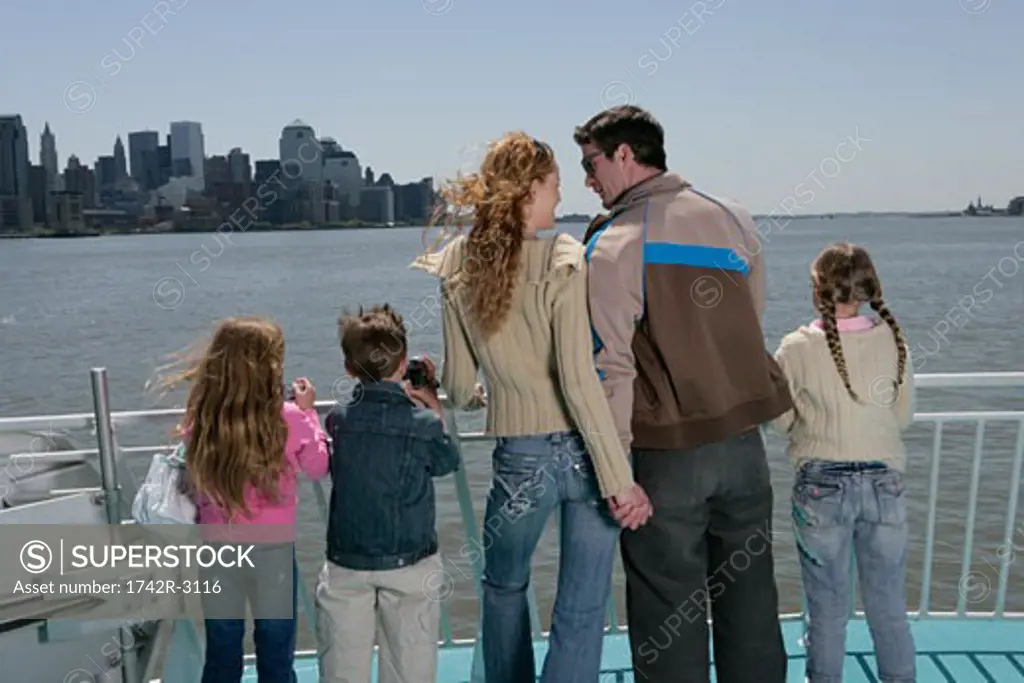 Family of five on the bow of a ferryboat