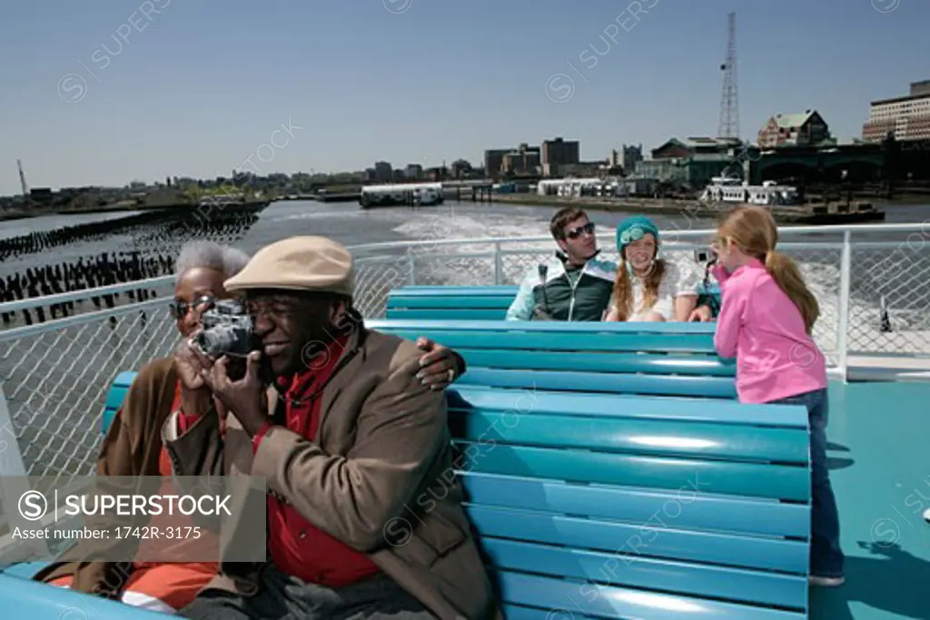 Passengers on a boat taking pictures