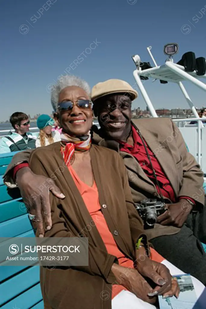 Mature couple sitting on a ferryboat