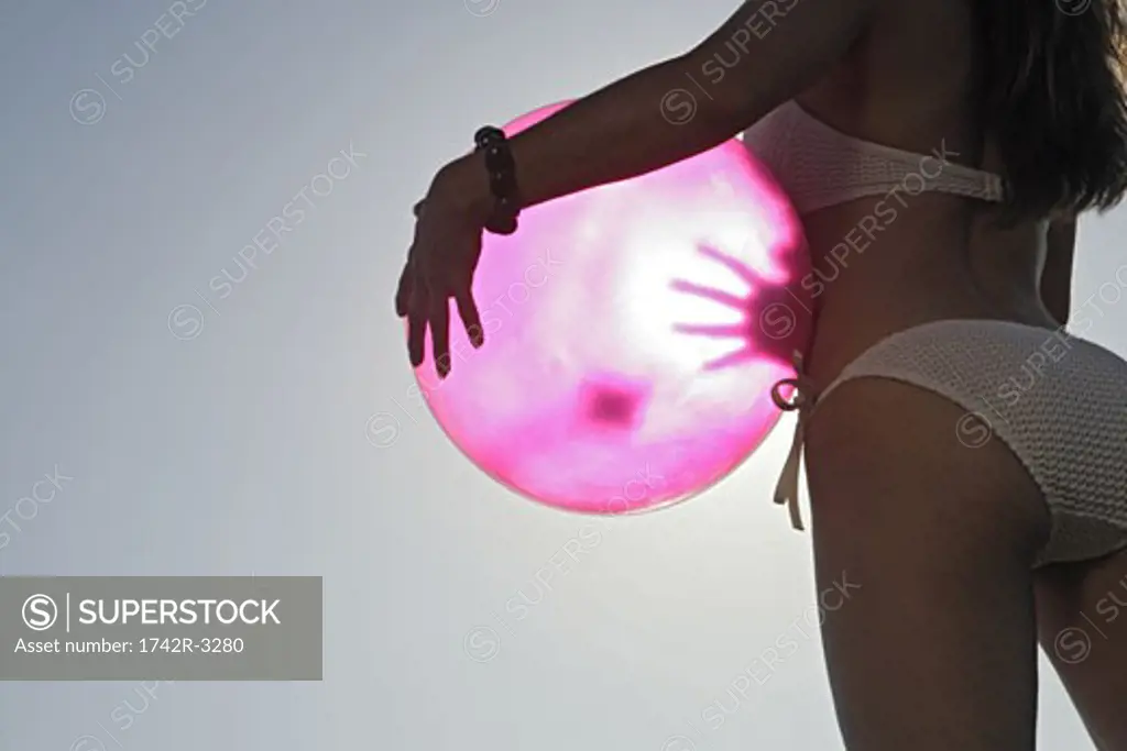 View of a woman holding a ball