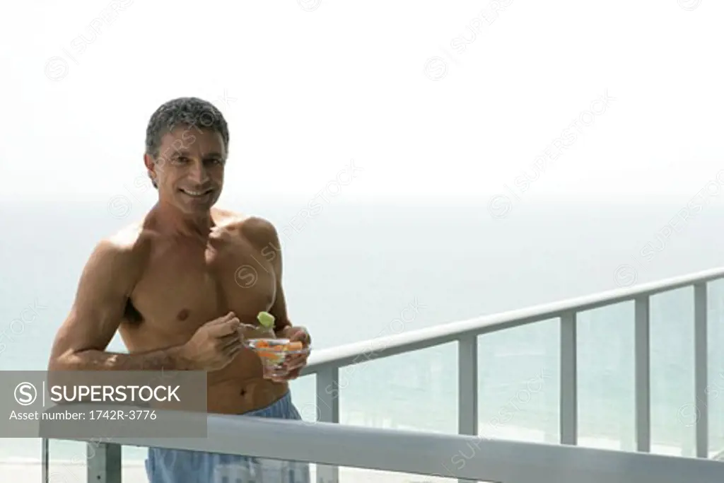 Mature man on a balcony