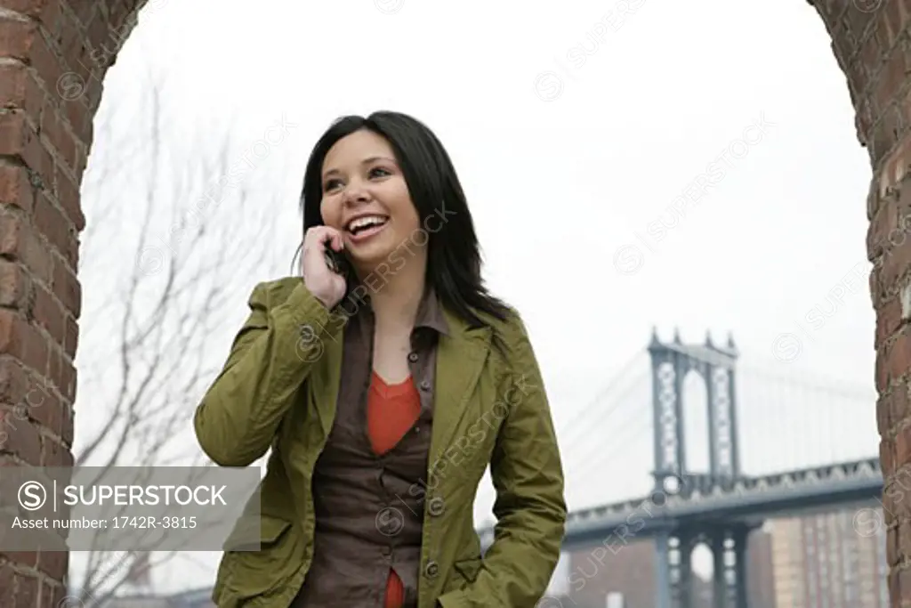View of young woman talking with its cell phone.