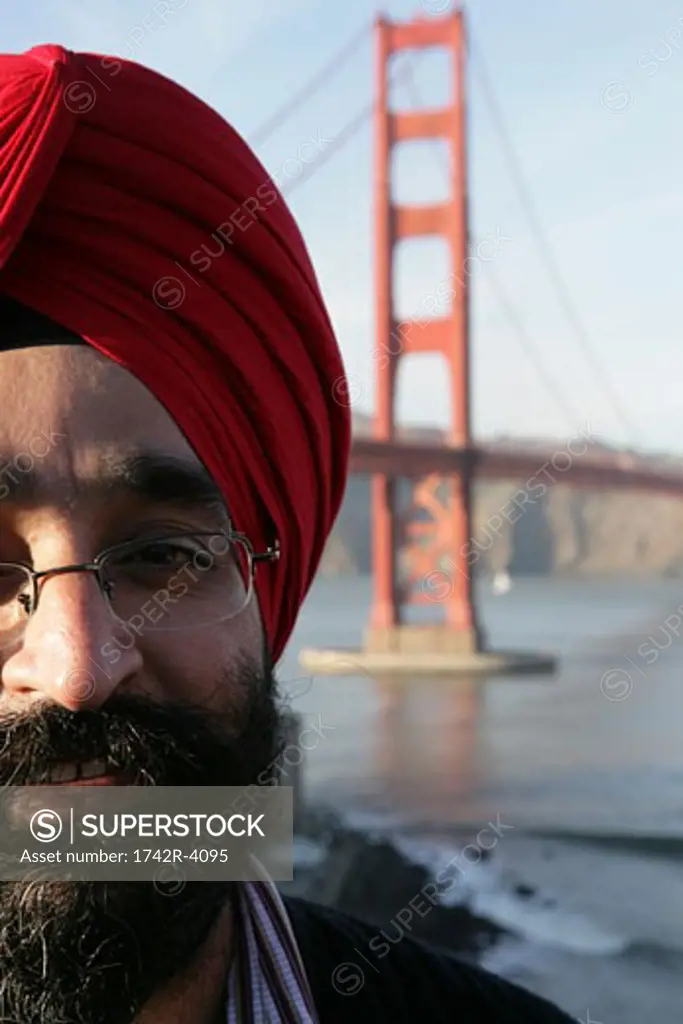 Man wearing a turban near the Golden Gate Bridge
