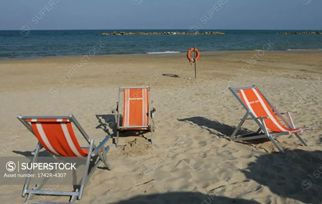 Folding chairs on beach, high angle view